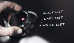 image of hand turning dial from blacklist to whitelist